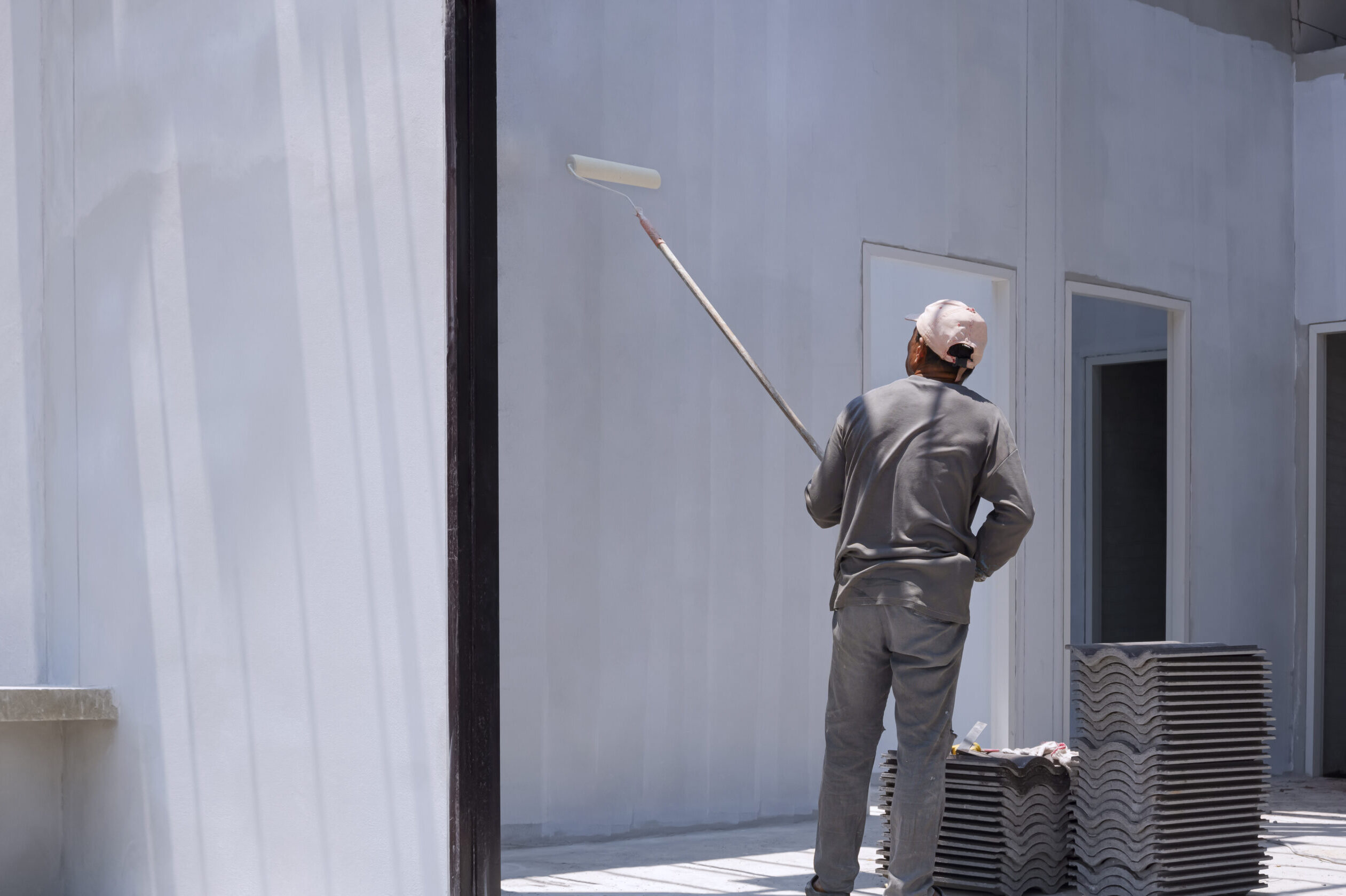 asian-builder-worker-applying-primer-white-paint-o-2025-03-11-05-05-06-utc
